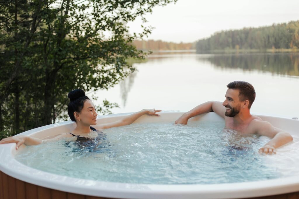 Relaxing in a hot tub by lake.